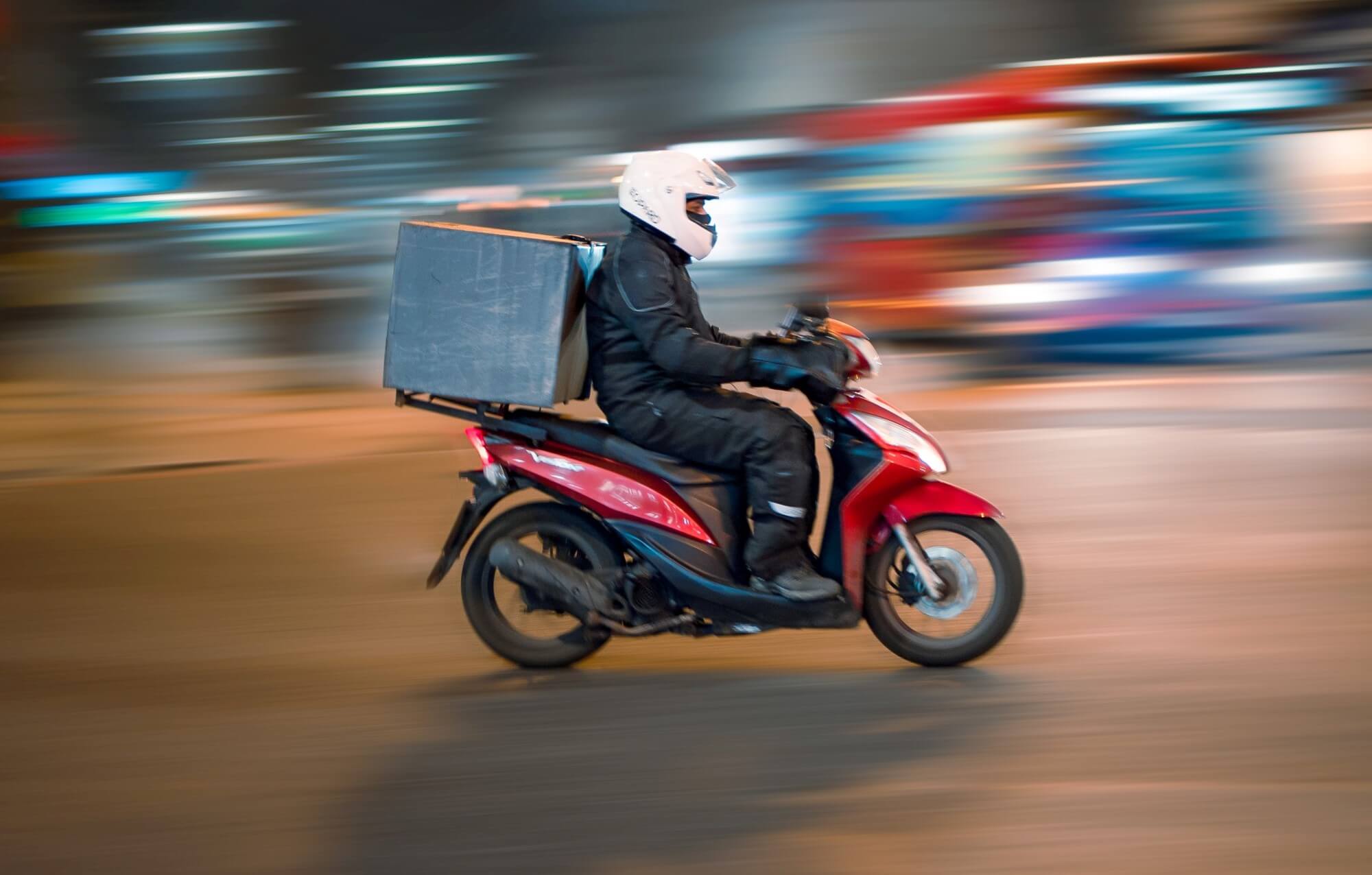 Person riding a scooter with blurred background